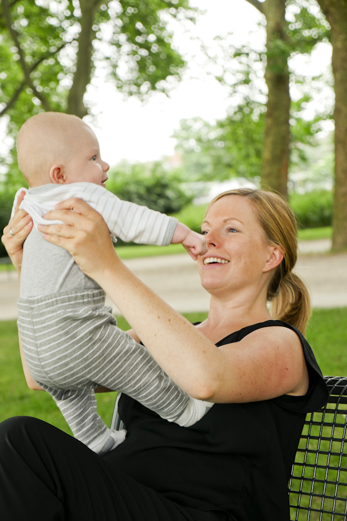 Happy mother with her baby in the park